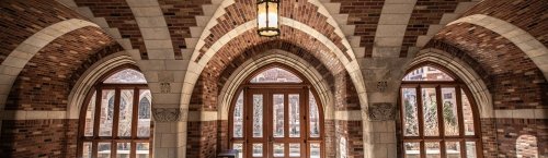 A view inside the Humanities Quadrangle that highlights the arched ceiling and play of light in the foyer.